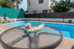 The swimming pool at or close to Sun & Sand Private Villa