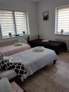 Łóżko lub łóżka w pokoju w obiekcie Apartament Angelo