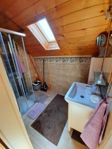 a small bathroom with a sink and a shower at Víkendový Dom U Vasila in Krahule +46 photos