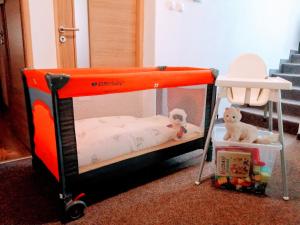 a bunk bed with a crib and stuffed animals in it at Apartmán Paula -blízko Tatralandie a Bešeňovej in Liptovský Mikuláš +16 photos