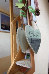 a sign that reads write homomed hanging on a ladder at Ferienhaus beim Imker in Marienberg