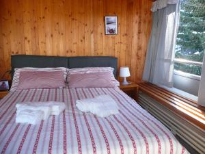 Postel nebo postele na pokoji v ubytování Appartamento Sole Alto