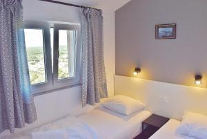 Postel nebo postele na pokoji v ubytování Penthouses Panorama