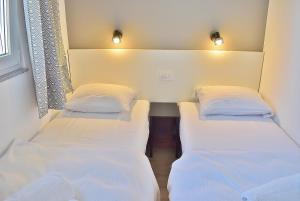 Postel nebo postele na pokoji v ubytování Penthouses Panorama