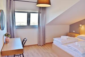 Postel nebo postele na pokoji v ubytování Penthouses Panorama