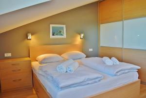 Postel nebo postele na pokoji v ubytování Penthouses Panorama