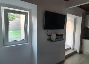 TV a/nebo společenská místnost v ubytování Vila Azul + 4 fotografie