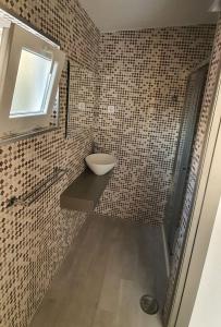 a bathroom with a sink and a toilet in it at Vila Azul in Sesimbra