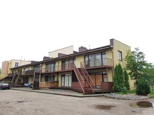 a building with stairs on the side of it at Palanga-Smilgu. g. in Palanga