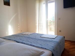 Postelja oz. postelje v sobi nastanitve Apartments Božito