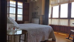 Postel nebo postele na pokoji v ubytování FORJAS DE ORZALES