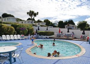 a group of children playing in a swimming pool at Fishguard Holiday Park in Fishguard