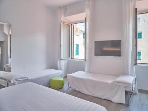 Кровать или кровати в номере Hotel Medusa