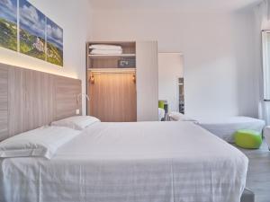 Кровать или кровати в номере Hotel Medusa