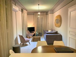 a living room with a couch and a table at Christopher's Apartments in Skala