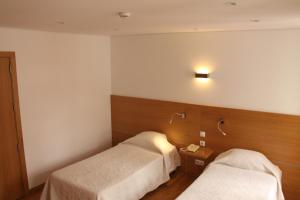 Postel nebo postele na pokoji v ubytování Hotel Zenite