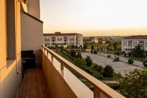a balcony of a building with a view of a street at BLISS Apartment in Constanţa