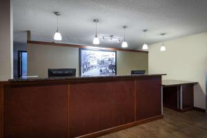 an office with a reception desk and a screen at Super 8 by Wyndham Cromwell/Middletown in Cromwell