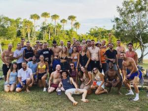 a large group of people posing for a picture at Darwin Hostel in Darwin