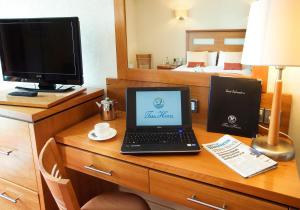 a laptop computer sitting on a desk in a hotel room at Tara Hotel in Killybegs