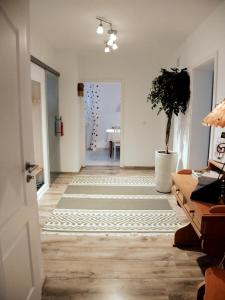 a room with a hallway with a potted plant at Ferienhaus Am Stadtpark in Bad Harzburg