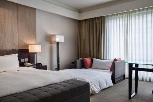 Katil atau katil-katil dalam bilik di The Tango Hotel Taipei XinYi