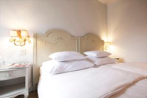 Posteľ alebo postele v izbe v ubytovaní Das REGINA Boutiquehotel