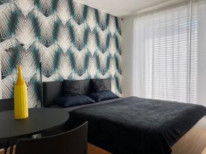 Postel nebo postele na pokoji v ubytování Business Apartments + 17 fotografií