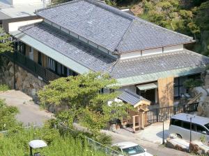 an overhead view of a house with a solar roof at Shirahama Meiji Villa in Shirahama