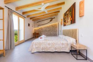 Ein Bett oder Betten in einem Zimmer der Unterkunft Finca Can Blai