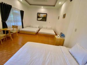 Postel nebo postele na pokoji v ubytování Giao Giao House Homestay
