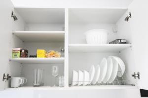 Una cocina o cocineta en Nest Port View Apartment
