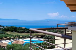a view of the ocean from a balcony of a resort at Hotel Santa Chiara in Capo Vaticano