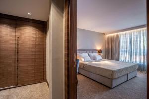 Posteľ alebo postele v izbe v ubytovaní Hotel Tonanti