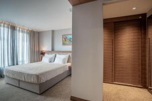 Posteľ alebo postele v izbe v ubytovaní Hotel Tonanti