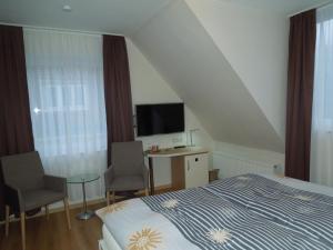 TV a/nebo společenská místnost v ubytování Hotel Gode Wind