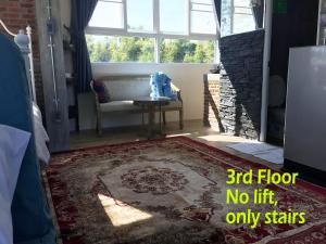 a living room with a floor no lift only stairs at KHAO KHO SKY WINDS in Khao Kho