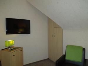 TV a/nebo společenská místnost v ubytování Hotel Gode Wind