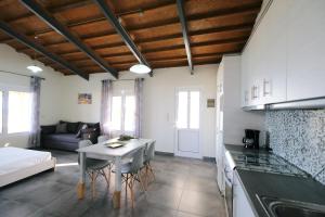 a kitchen and living room with a table and a couch at Thealassa in Kalliópi +37 photos