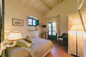 Кровать или кровати в номере Country Relais La Mortella
