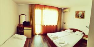 A bed or beds in a room at Villa Diana Self check-in