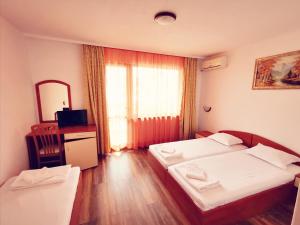 A bed or beds in a room at Villa Diana Self check-in
