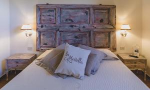 Кровать или кровати в номере Country Relais La Mortella