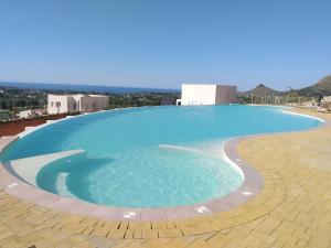 a large swimming pool on top of a building at Villa Edori - Giardino degli Allori in Castellammare del Golfo