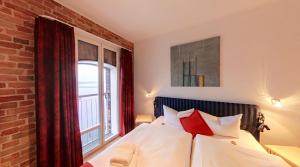 Postel nebo postele na pokoji v ubytování Speicher Barth - Superior-Hotel
