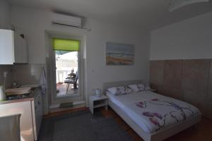 Кровать или кровати в номере Apartmani Rina