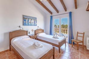 Postel nebo postele na pokoji v ubytování Villa Paula