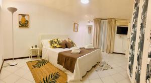a bedroom with a large bed in a room at Pancrazio in Taormina