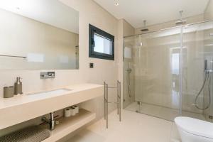 a bathroom with a sink and a shower at The Villa / Ericeirahills in Ericeira +14 photos