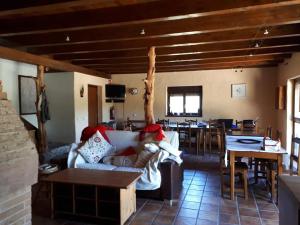 a living room with a couch and a dining room at Albergue A'Noguera in Castiello de Jaca